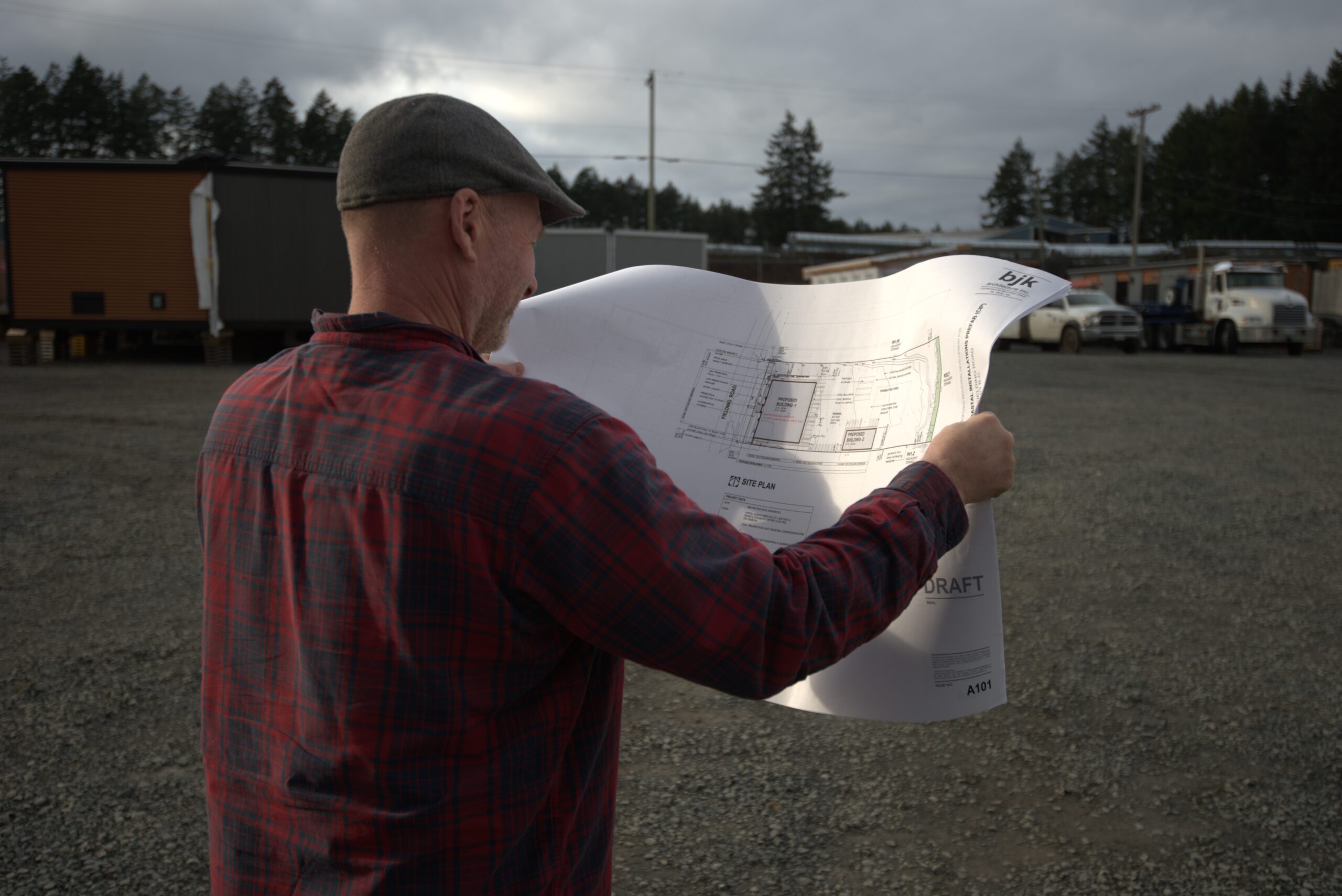 Pic of Mike Davies looking at factory plans